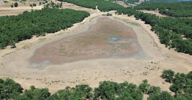 A drone view shows a pond on the brink of drying up due to climate change in the Söğüt district of western Bilecik province, Türkiye, Aug. 20, 2025. (AA Photo)