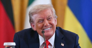 U.S. President Donald Trump smiles during a meeting with Ukrainian President Volodymyr Zelenskyy and European leaders in the East Room of the White House in Washington, D.C., Aug. 18, 2025. (AFP Photo)