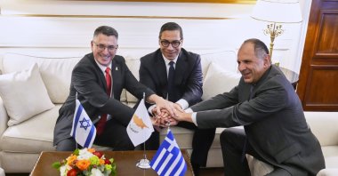 (L to R) Israel&#039;s Foreign Minister Gideon Sa&#039;ar, Greek Cypriot Foreign Minister Constantinos Kombos and Greek Foreign Minister Giorgos Gerapetritis shake hands during a trilateral meeting on energy cooperation, Athens, Greece, March 13, 2025. (AP Photo)