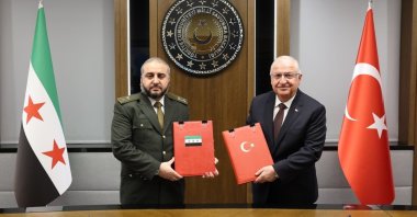 Defense Minister Yaşar Güler (R) and his Syrian counterpart Murhaf Abu Qasra pose after signing a military cooperation agreement at the Defense Ministry, Ankara, Türkiye, Aug.13, 2025 (IHA Photo)