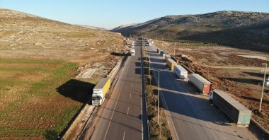 Trucks are seen near the Cilvegözü border crossing with Syria in the Reyhanlı district of the southern province of Hatay, Türkiye, Jan. 20, 2025. (IHA Photo)