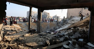 Palestinians inspect the site of an overnight Israeli air strike on a house, in Khan Younis in the southern Gaza Strip, July 28, 2025. (Reuters File Photo)