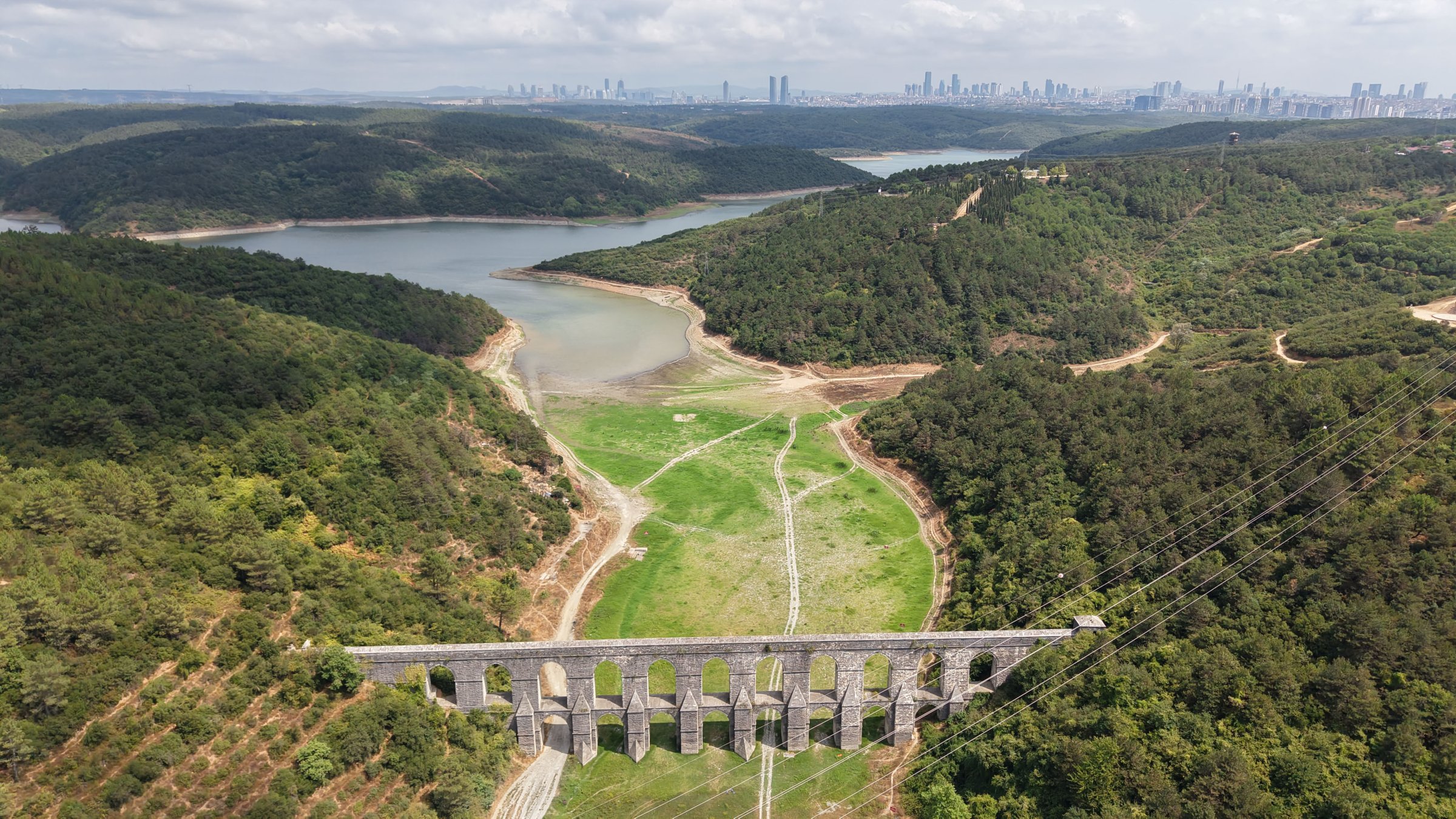 An aerial view of a nearly dried dam showing cracked earth and receded water levels, Istanbul, Türkiye, Aug. 22, 2025. (DHA Photo)