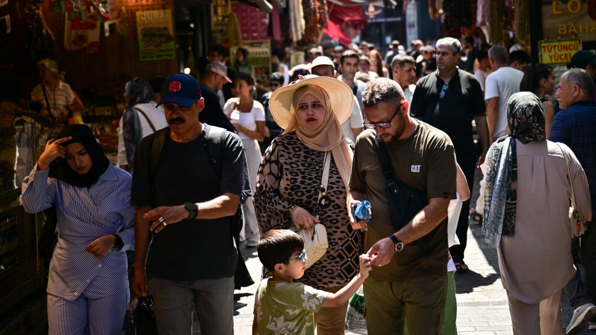 Tourists are seen in the famous Eminönü neighborhood, Istanbul, Türkiye, Aug. 22, 2025. (AA Photo)