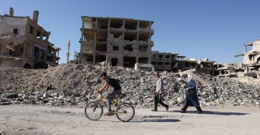 A view of destroyed houses, ruined mosques and empty streets reflects the years of war in Yarmouk camp, as wall paintings and people struggling to survive bear the marks of resilience, near Damascus, Syria, Aug. 16, 2025. (AA Photo)