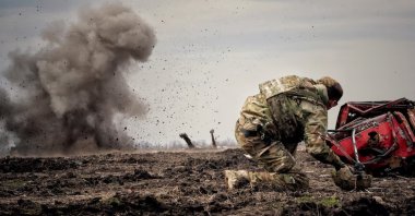 Ukrainian serviceman reacts as he throws a grenade during a training, amid Russia&#039;s invasion of Ukraine, Donbas, Ukraine, April 8, 2023. (Reuters Photo)