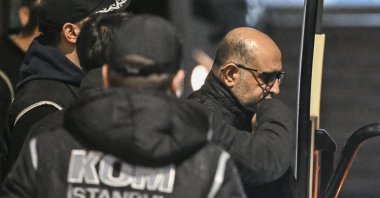 Police escort Aziz İhsan Aktaş after his detention, in Istanbul, Türkiye, Jan. 17, 2025. (AA Photo)