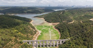 An aerial view of a nearly dried dam showing cracked earth and receded water levels, Istanbul, Türkiye, Aug. 22, 2025. (DHA Photo)