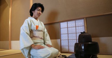 Tea ceremony master Keiko Kaneko demonstrates the tea ceremony at her tea house, Tokyo, Japan, Aug. 8, 2025. (AP Photo)