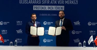 Turkish Statistical Institute (TurkStat) President Erhan Çetinkaya (R) and Zero Waste Foundation President Samed Ağırbaş hold the signed cooperation protocol, Istanbul, Türkiye, Aug. 22, 2025. (IHA Photo)