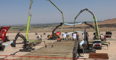 Workers are seen at a site as Türkiye breaks ground for the Kars-Iğdır-Aralık-Dilucu railway line, Kars, northeastern Türkiye, Aug. 22, 2025. (AA Photo)