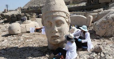Experts carry out nanotechnology restoration work on a colossal statue at Mount Nemrut, Adıyaman, southeastern Türkiye, Aug. 21, 2025. (AA Photo)