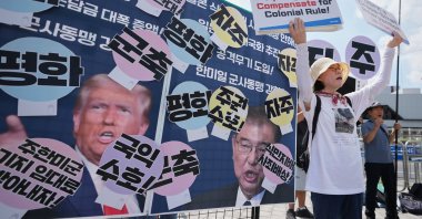 Members of civic group shout slogans next to pictures of U.S. President Donald Trump and Japanese Prime Minister Shigeru Ishiba during a rally ahead of South Korean President Lee Jae Myung&#039;s visit to Japan, Seoul, South Korea, Aug. 22, 2025. (AP Photo)