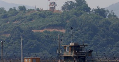A North Korean soldier stands guard at his guard post inside North Korean territory, in this picture taken from Paju, South Korea, near the demilitarized zone (DMZ) separating the two Koreas, June 17, 2020. (Reuters Photo)