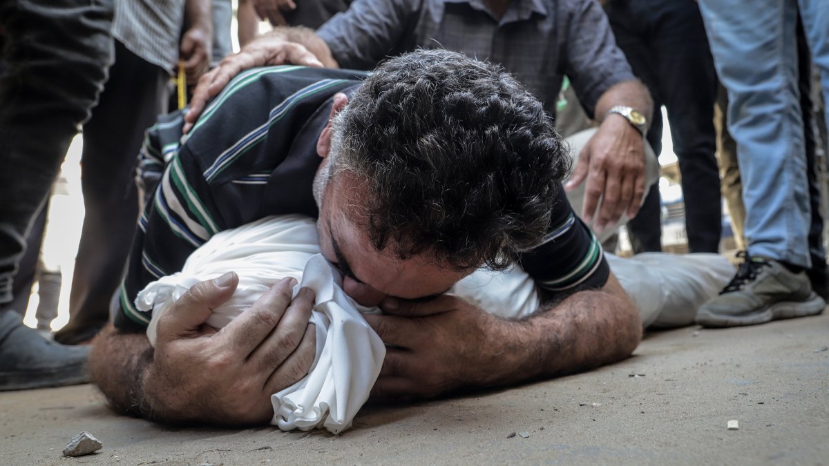 A Palestinian man mourns a loved one killed in an Israeli attack in Gaza, Palestine, Aug. 24, 2025. (AA Photo) 
