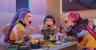 This image released by Netflix shows characters, from left, Rumi, Zoey, and Mira in a scene from &quot;KPop Demon Hunters.&quot; (AP Photo)