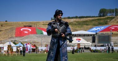 A man dressed in ancient Turkish military garb poses at the venue set up for anniversary events in Ahlat, Bitlis, Türkiye, Aug. 24, 2025. (AA Photo)