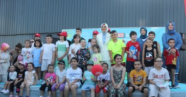 Family and Social Services Minister Mahinur Özdemir Göktaş interacts with children during the digital detox camp, Rize, Türkiye, Aug. 23, 2025. (AA Photo)