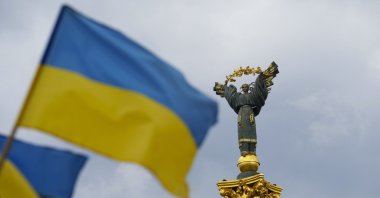 The Independence Monument is pictured as Ukrainian flags blow in the wind in Kyiv, Ukraine, on Saturday, Aug. 23, 2025. (AP Photo)