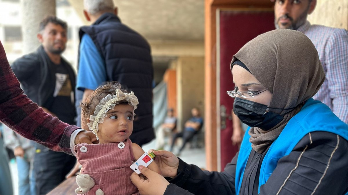 United Nations Relief and Works Agency (UNRWA) health staff screen children for malnutrition in UNRWA clinics, Gaza Strip, Palestine, July 2025. (Courtesy of UNRWA)