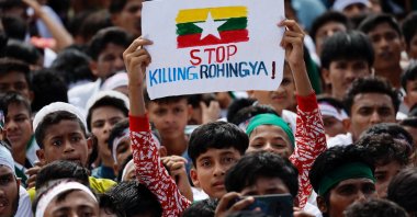 A Rohingya refugee holds a placard while taking part in a protest rally inside a refugee camp in Cox&#039;s Bazar, Bangladesh, Aug. 25, 2025. (Reuters Photo)