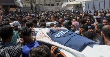 People attend a funeral in the courtyard of Nasser Hospital for the journalists killed in the Israeli attack, Khan Younis, southern Gaza, Palestine, Aug. 25, 2025.