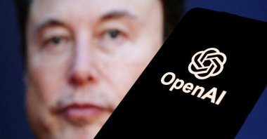 The OpenAI logo is seen in front of Elon Musk&#039;s photo in this illustration taken March 11, 2024. (Reuters File Photo)
