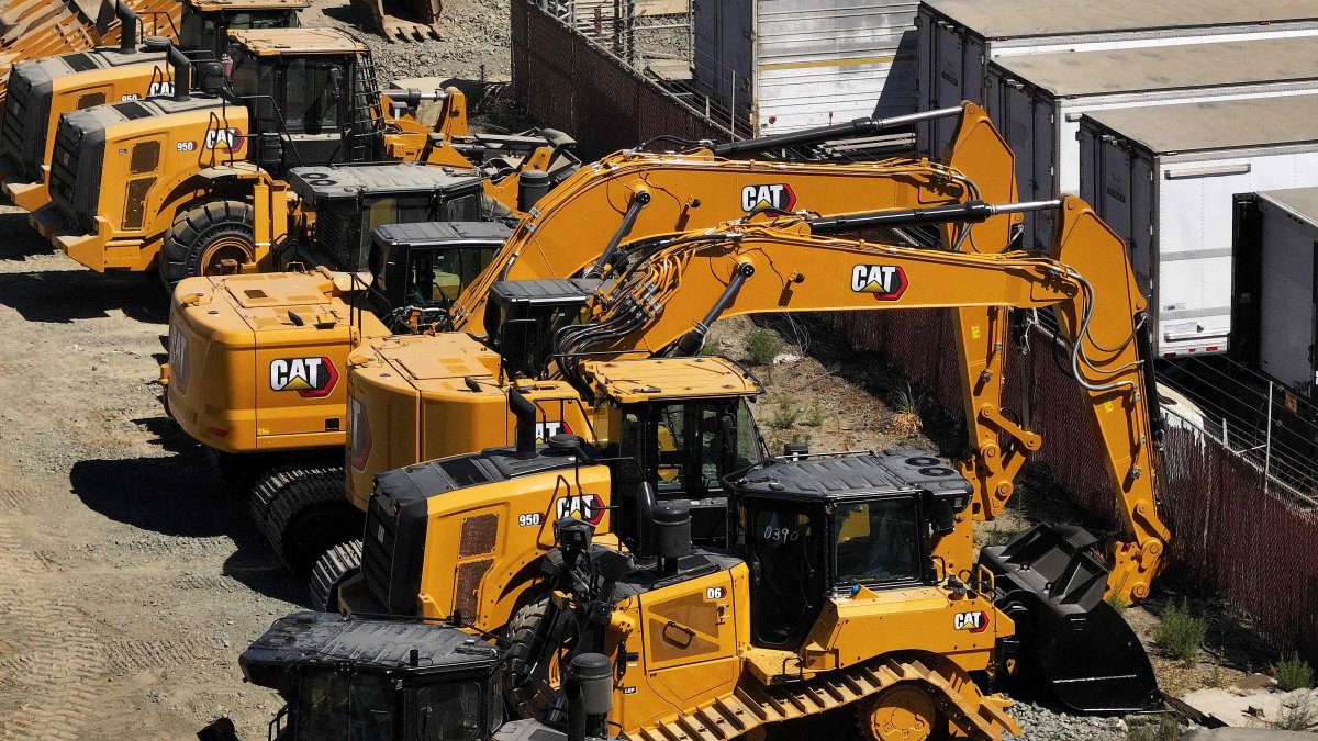 Caterpillar equipment sits parked in a lot, San Leandro, California, U.S., Aug. 5, 2025. (AFP Photo)