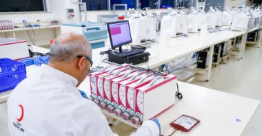 A Turkish Red Crescent (Kızılay) team member carefully processes stem cell samples in the laboratory, Ankara, Türkiye, Aug. 26, 2025. (AA Photo)
