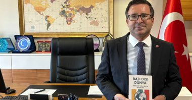 Professor Mehmet Özkan holds his book &quot;The Non-Western World: Foreign Policy Horizons in India, South Africa and Türkiye,&quot; Istanbul, Türkiye, Aug. 6, 2025. (Courtesy of writer)