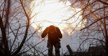 A Ukrainian serviceman reacts after firing a 120-mm mortar toward Russian troops at the frontline, near Vovchansk in the Kharkiv region, Ukraine, Jan. 16, 2025. (Reuters Photo)