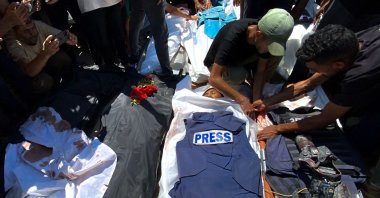 People mourn over the bodies of Palestinian journalists killed in an Israeli strike on Nasser Hospital, Khan Younis, southern Gaza Strip, Palestine, Aug. 25, 2025. (AFP Photo)