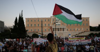 A pro-Palestinian protester waves a Palestinian flag in front of the Greek Parliament during a demonstration in support of Palestinians, at Syntagma Square in Athens, Greece, Aug. 24, 2025. (Reuters Photo)