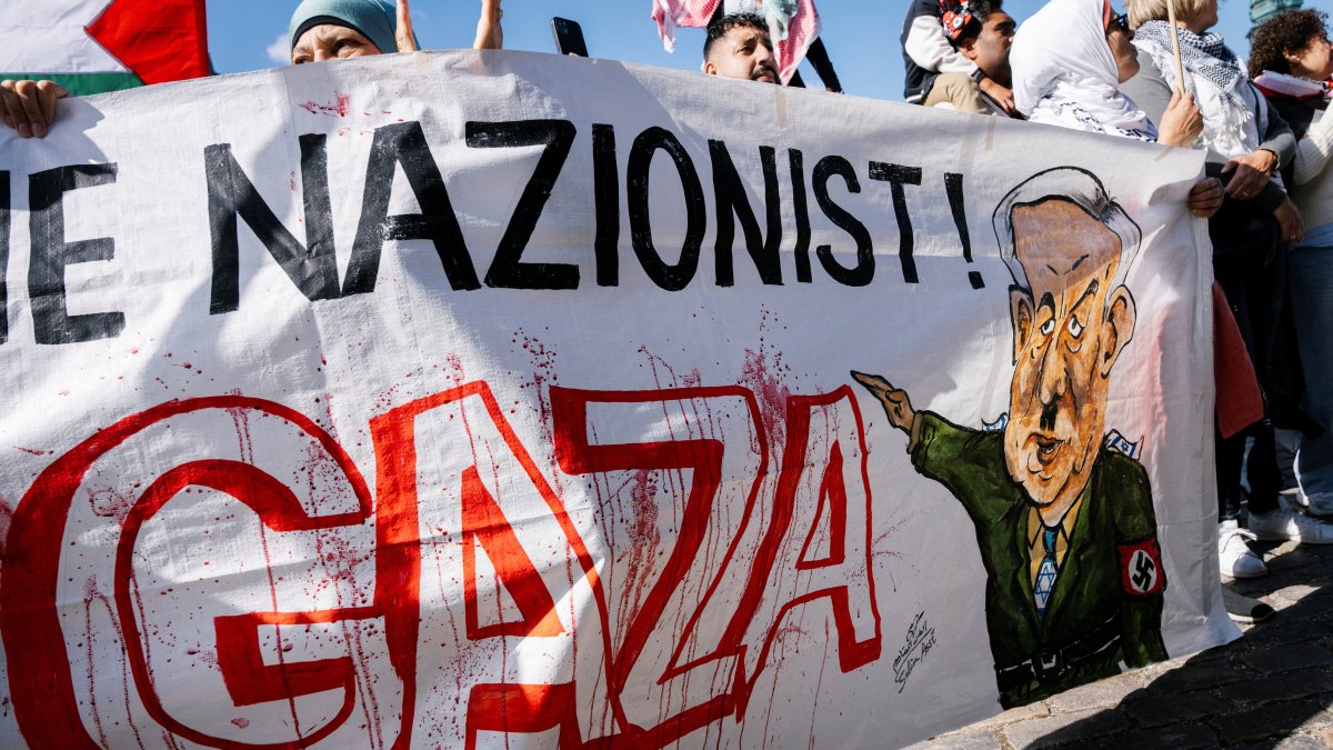 Protesters hold a banner depicting Israeli Prime Minister Benjamin Netanyahu during a demonstration, Copenhagen, Denmark, Aug. 24, 2025. (Reuters Photo)