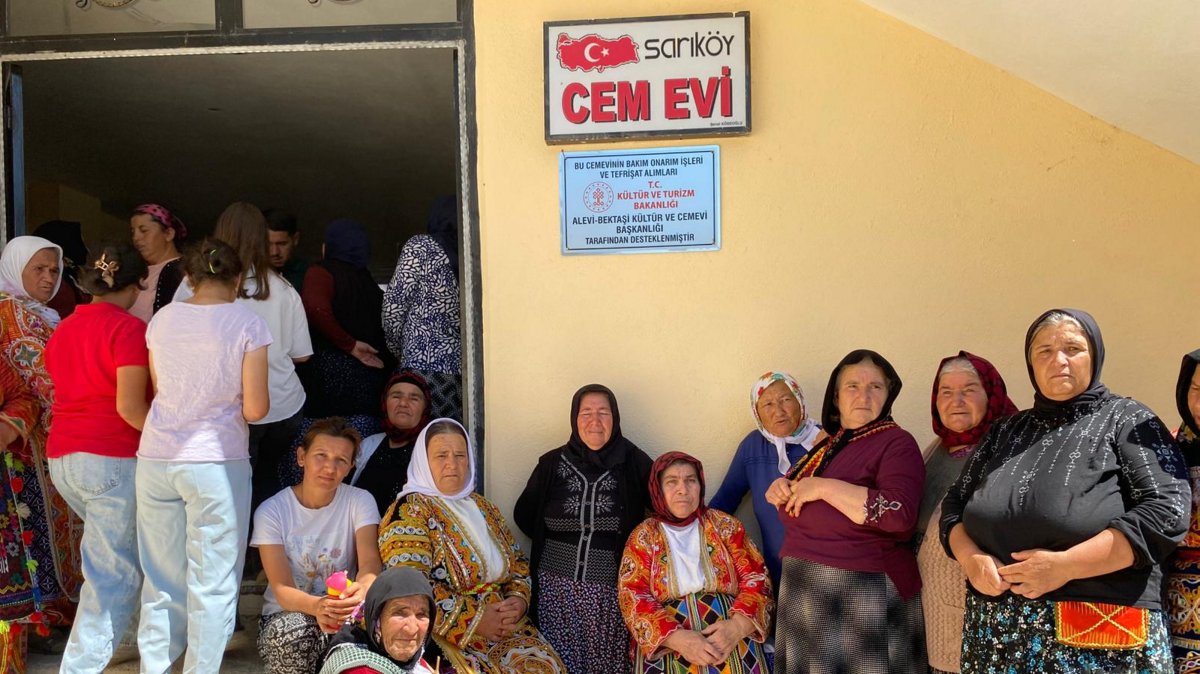 Dozens of women stand outside a cemevi, one of 26 Alevi houses of worship recently renovated and furnished with support from the Alevi-Bektashi Culture and Cemevi Presidency, Yozgat province, Türkiye, Aug. 21, 2025. (AA Photo)
