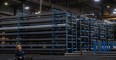 A worker moves a crane to lift a steel beam at Central Steel Supply Company, Marlborough, Massachusetts, U.S., March 13, 2025. (AFP Photo)