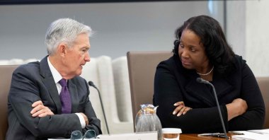 U.S. Federal Reserve Chair Jerome Powell speaks with Lisa Cook (R), member of the board of governors, as he chairs a Federal Reserve Board open meeting, Washington, D.C., U.S., June 25, 2025. (AFP Photo)