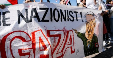 Protesters hold a banner depicting Israeli Prime Minister Benjamin Netanyahu during a demonstration, Copenhagen, Denmark, Aug. 24, 2025. (Reuters Photo)