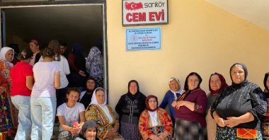 Dozens of women stand outside a cemevi, one of 26 Alevi houses of worship recently renovated and furnished with support from the Alevi-Bektashi Culture and Cemevi Presidency, Yozgat province, Türkiye, Aug. 21, 2025. (AA Photo)