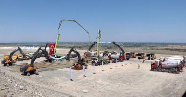 Workers are seen at a site as Türkiye breaks ground for the Kars-Iğdır-Aralık-Dilucu railway line, Kars, northeastern Türkiye, Aug. 22, 2025. (AA Photo)