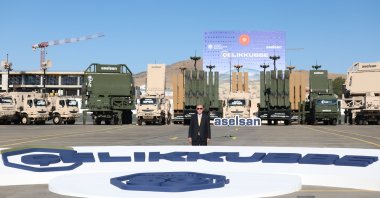 President Recep Tayyip Erdoğan poses for a photo with Aselsan&#039;s defense systems in the background, Ankara, Türkiye, Aug. 27, 2025. (AA Photo)