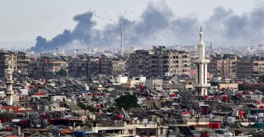 Smoke billows above buildings after an Israeli strike on the outskirts of Damascus, Syria, Nov. 22, 2023. (AFP File Photo)