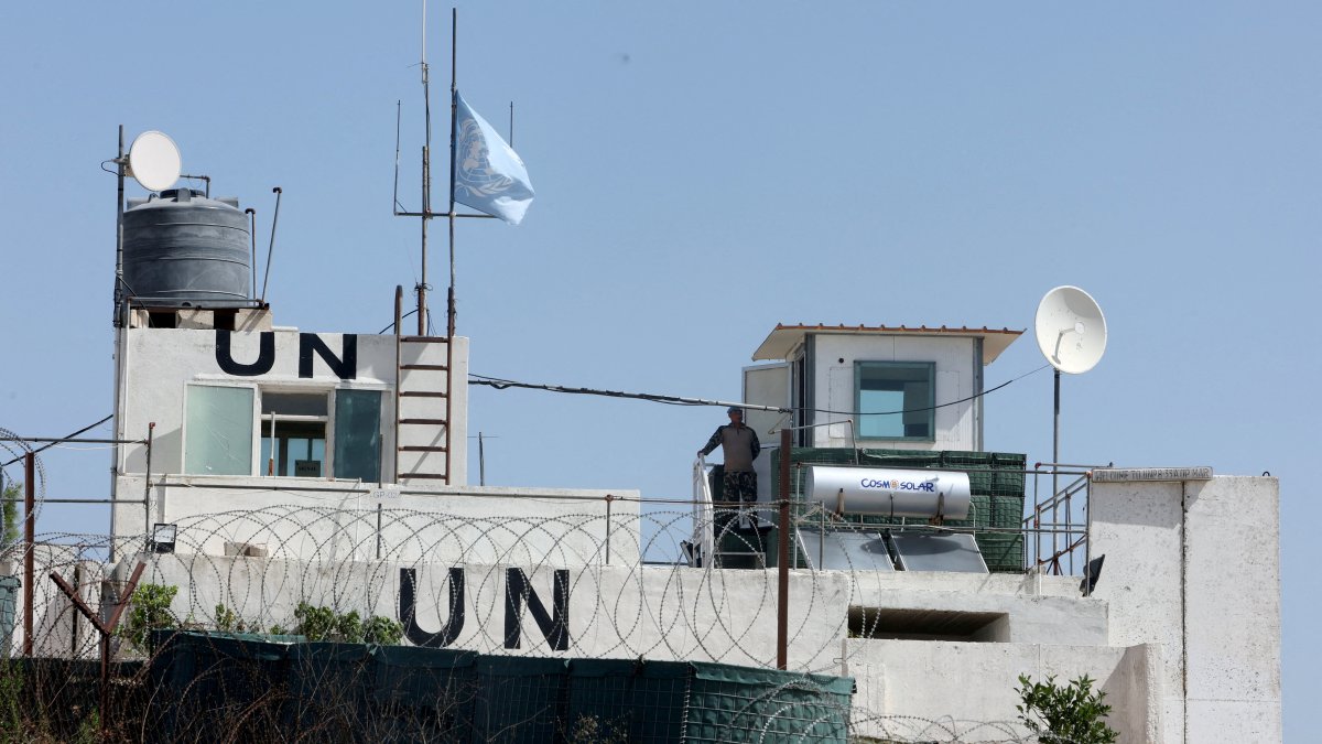 A U.N. peacekeeper of the United Nations Interim Force in Lebanon (UNIFIL) stands at his post in the village of Markaba, near the border with Israel, southern Lebanon, Aug. 31, 2023. (Reuters File Photo)
