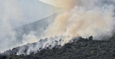 Firefighters battle a blaze in a forested area in Seydikemer, a district of Muğla, southwestern Türkiye, Aug. 21, 2025. (AA Photo)