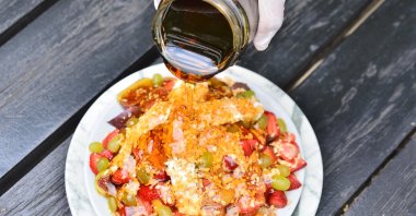 A plate of mixed honey, clotted cream and fruits. (DHA Photo)