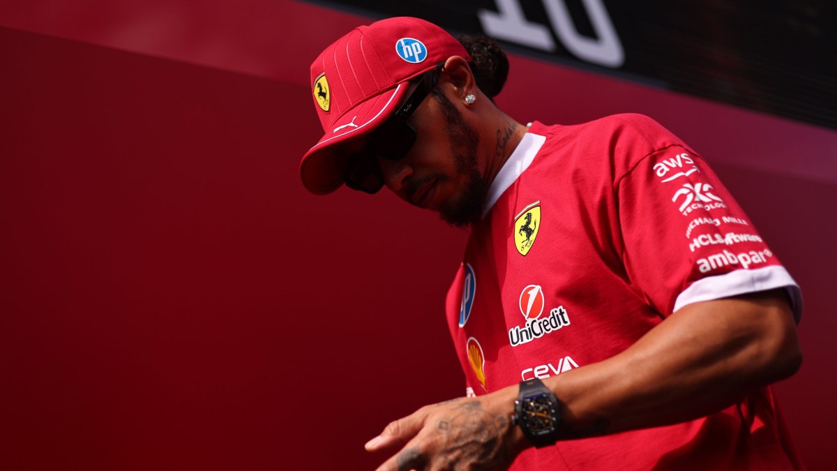 Ferrari driver Lewis Hamilton walks at the paddock before the third practice session for the Formula One Hungarian Grand Prix at the Hungaroring racetrack in Mogyorod, Budapest, Hungary, Aug. 2, 2025. (EPA Photo)