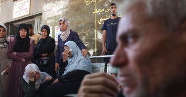 Palestinians mourn outside Shifa hospital in Gaza City where casualties of Israeli fire were transported ahead of their funerals, Aug. 29, 2025. (AFP Photo)