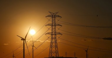 The sun sets behind wind turbines in Silivri on the outskirts of Istanbul, Türkiye, Aug. 16, 2025. (Reuters Photo)