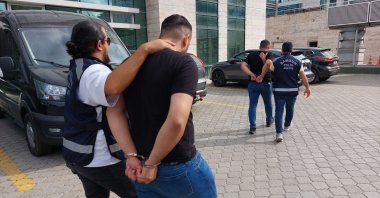 Police escort two captured suspects involved in an attack on CHP members during a brawl at a delegate election, in Samsun, northern Türkiye, Aug. 18, 2025. (İHA Photo)