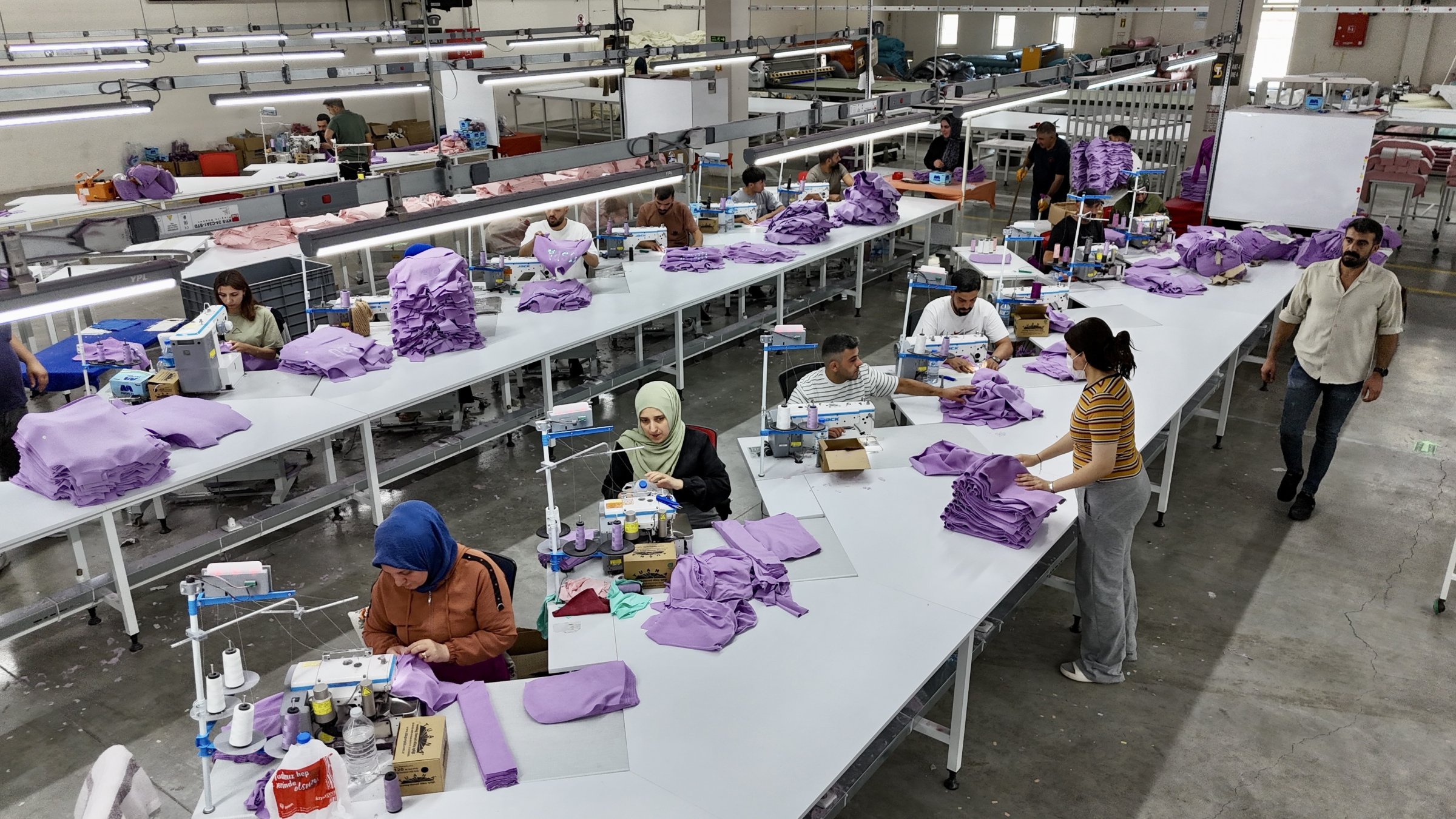 Workers are seen in a textile factory in Ağrı, eastern Türkiye, Aug. 15, 2025. (IHA Photo)